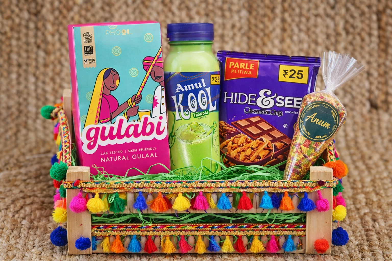 Holi gift hamper in pine wood box with gulal, thandai, cookies and candle